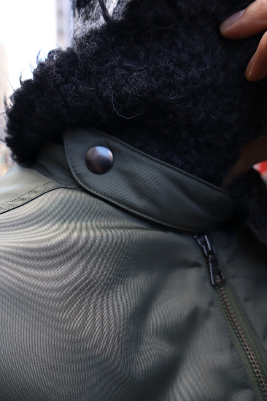 Oscar Ouyang  BOMBER JACKET WITH FAUX FUR SLEEVES AND COLLAR