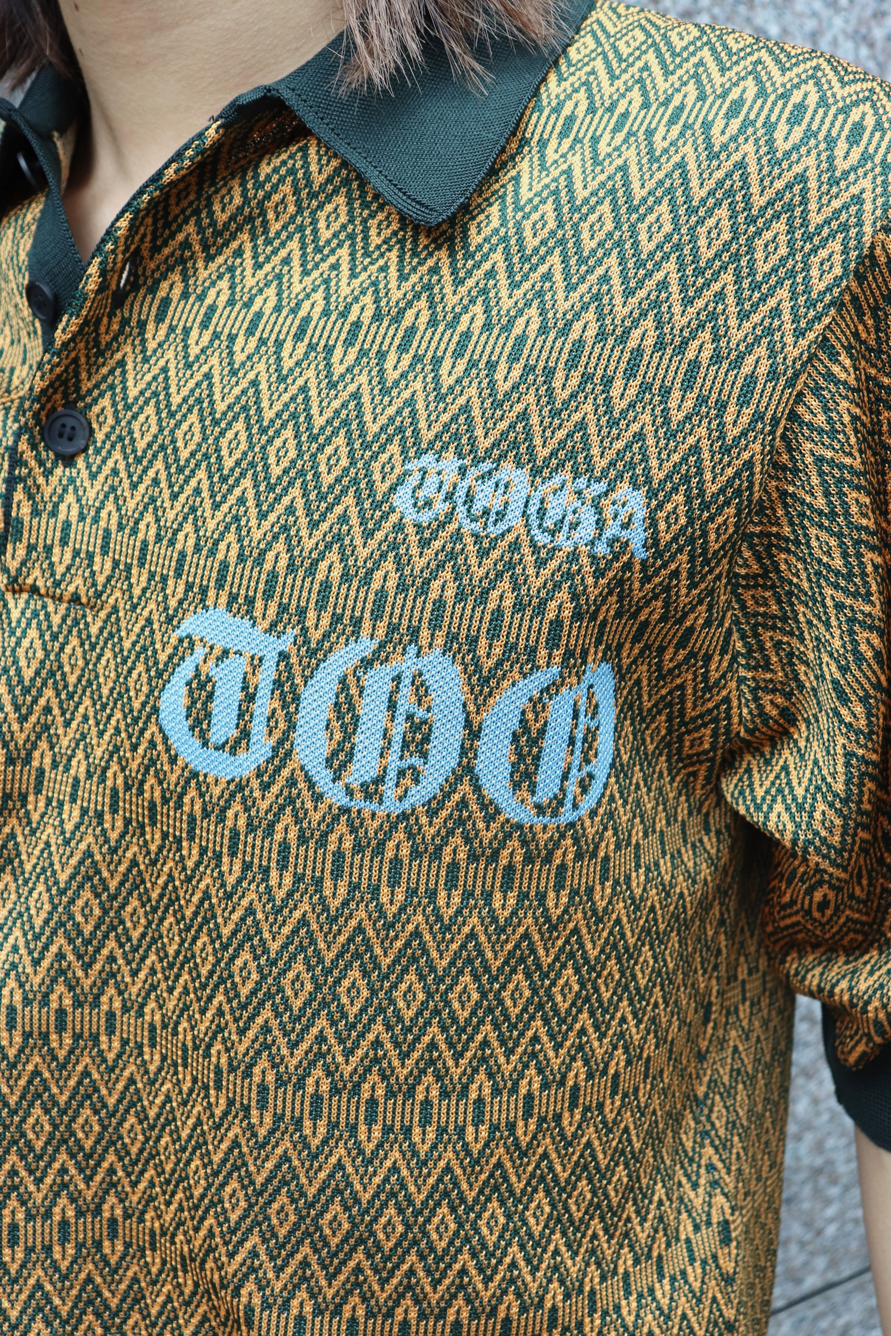 TOGA VIRILIS(トーガ ビリリース)のLogo knit polo shirt ORANGEの通販